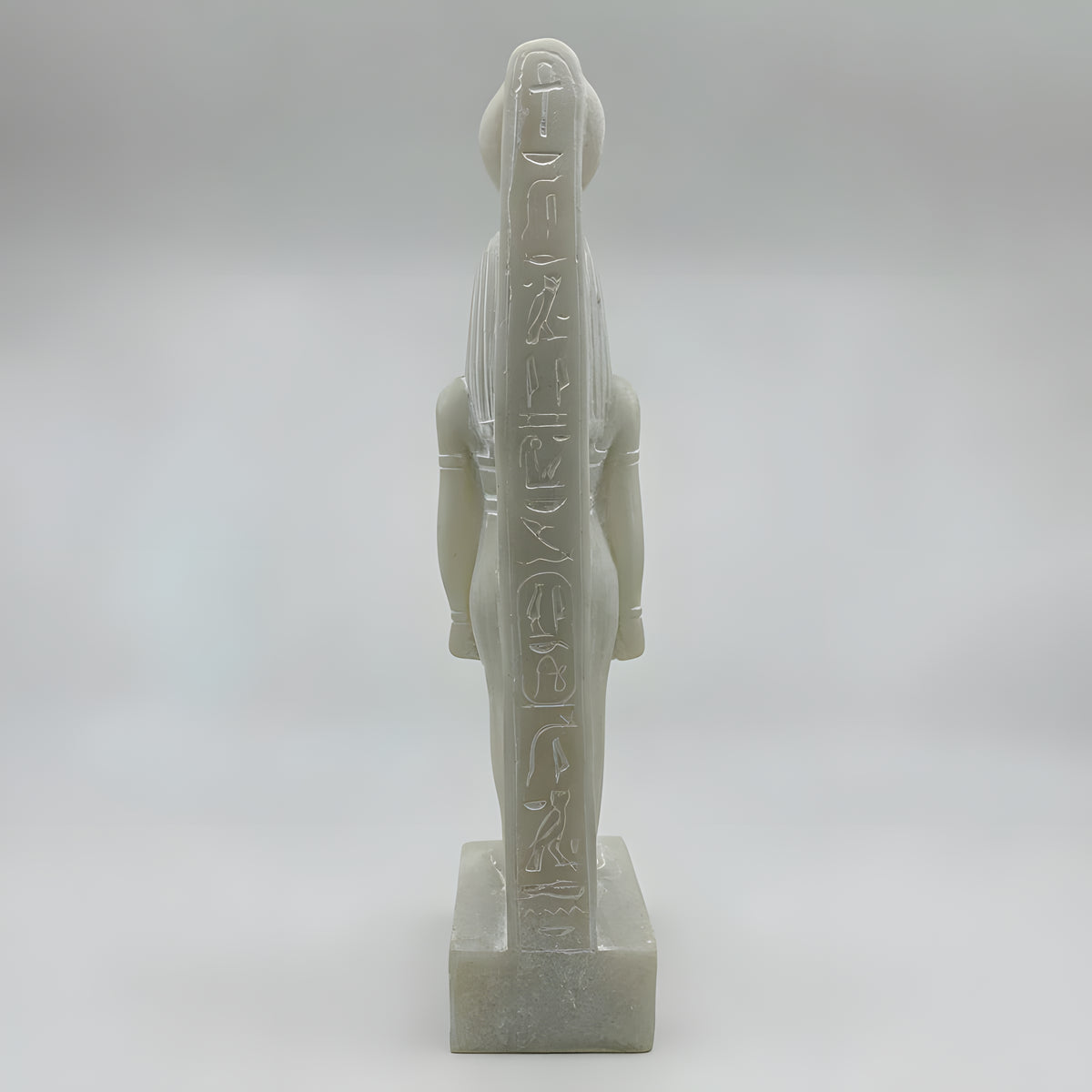Close-up of Hathor statue crown detail on white alabaster