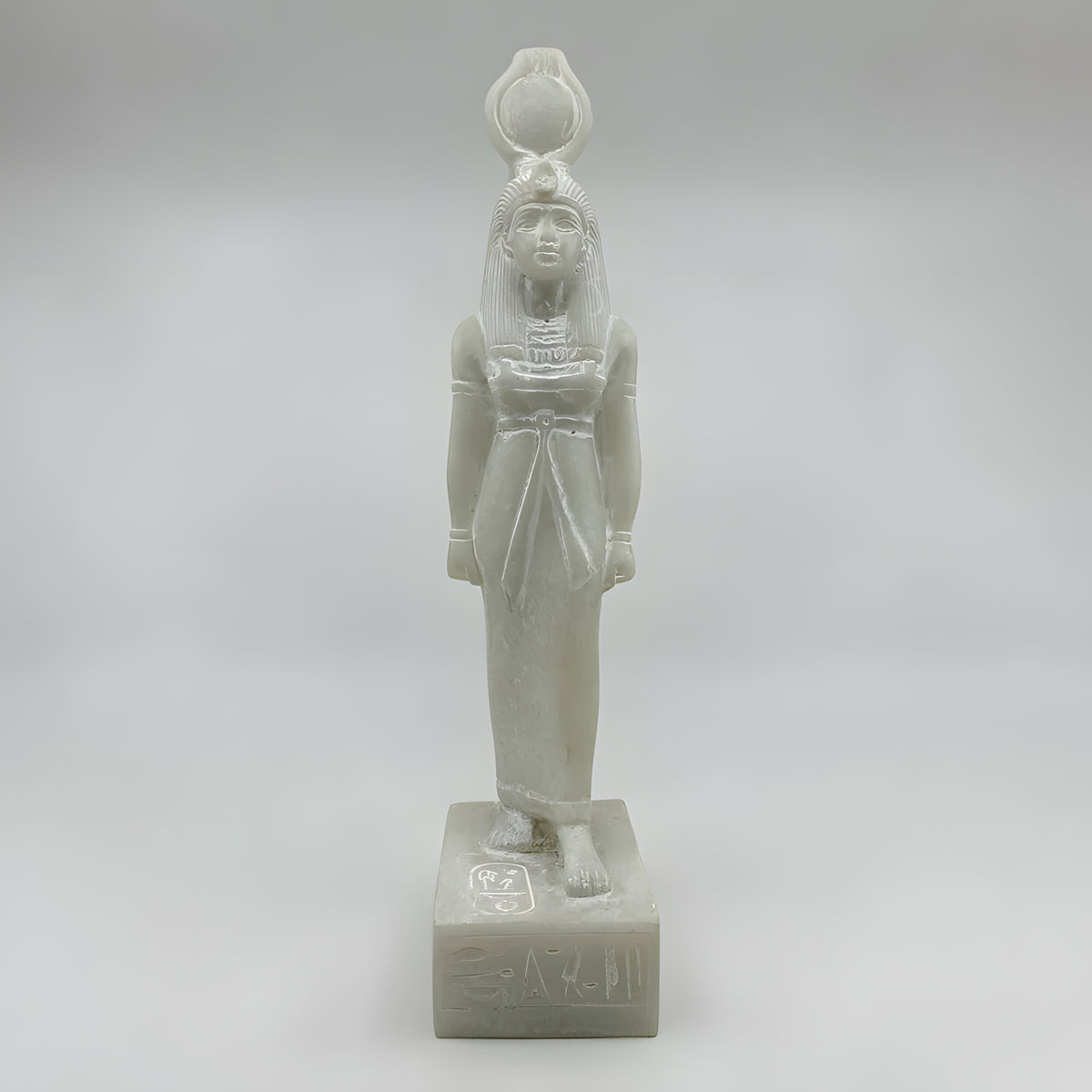 Side view of white alabaster Hathor statue replica