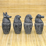 Close-up of hieroglyphic carving on canopic jars