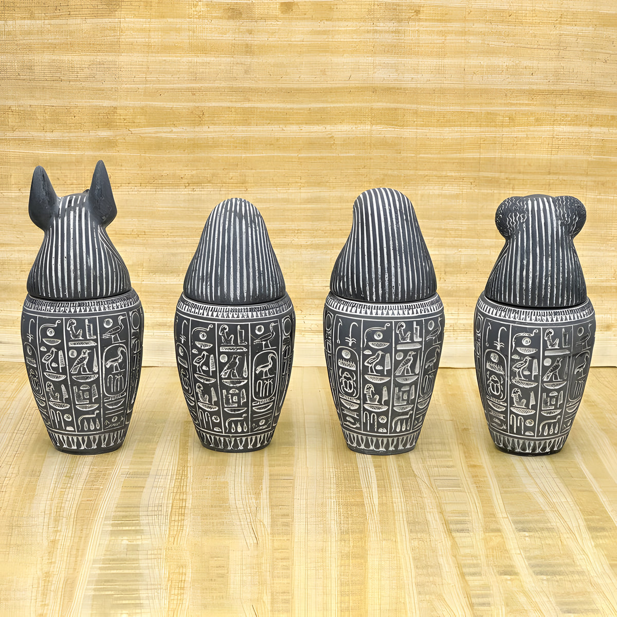 Set of four canopic jars with Sons of Horus heads