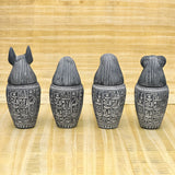 Set of four canopic jars with Sons of Horus heads