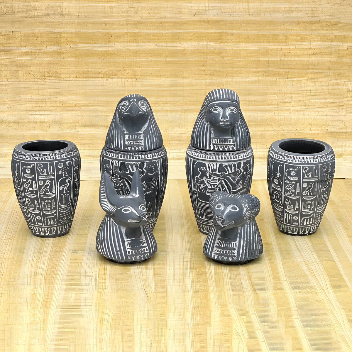 Side view of canopic jars set replica