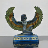 Close-up of wing detail on blue Isis statue