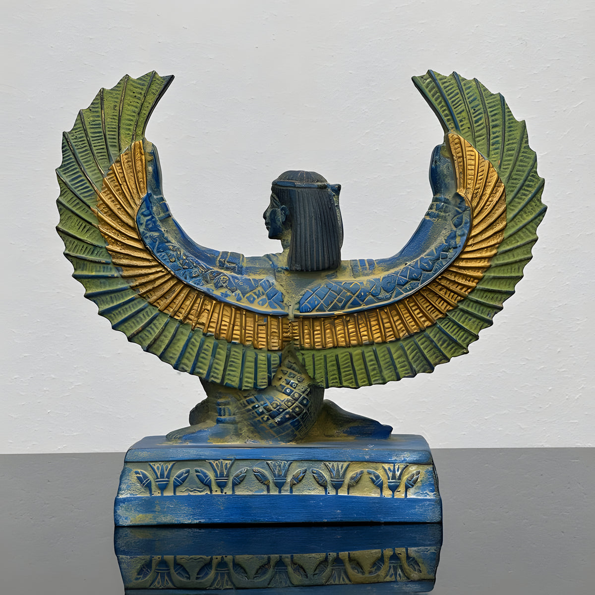 Side view of blue Isis statue replica
