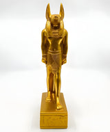Close-up of jackal head detail on golden Anubis statue