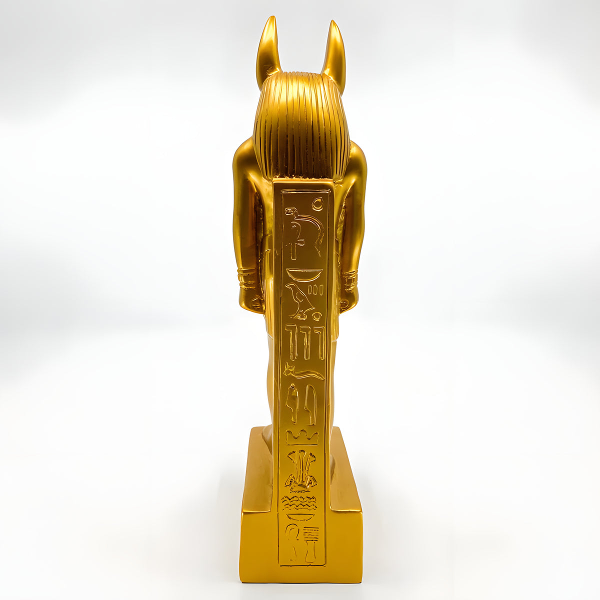 Side view of golden Anubis statue replica