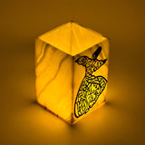 Side view of Egyptian vase lamp replica lit