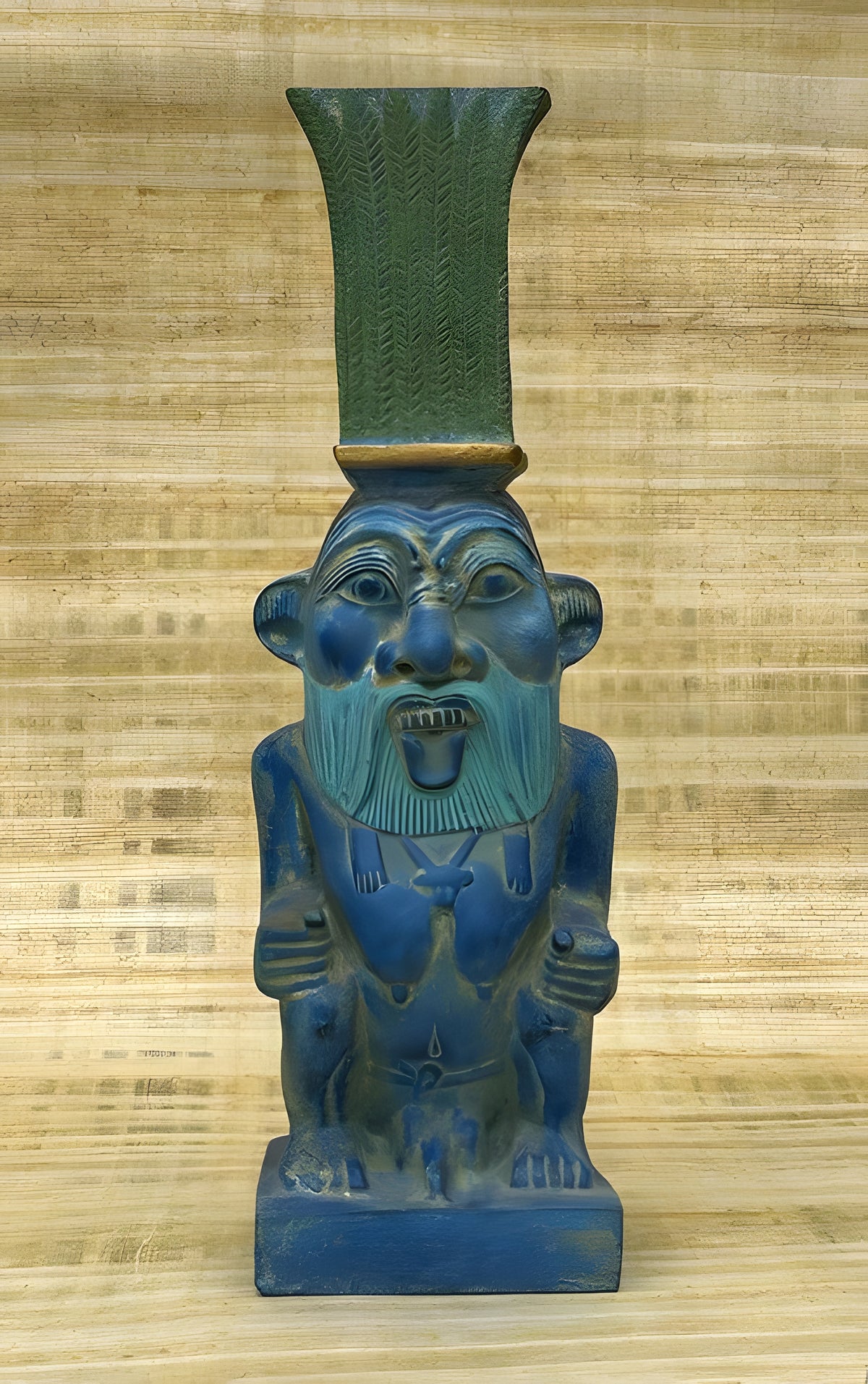 Side view of black stone Bes statue replica