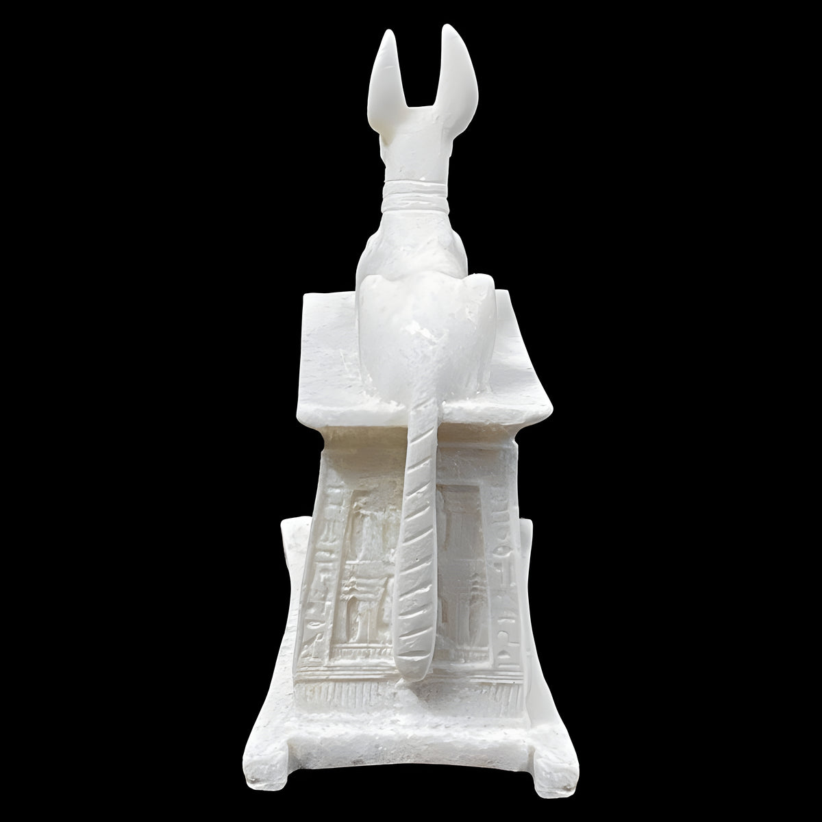 Side view of small alabaster Anubis statue replica