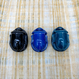 Close-up of the handmade Egyptian scarab amulet set