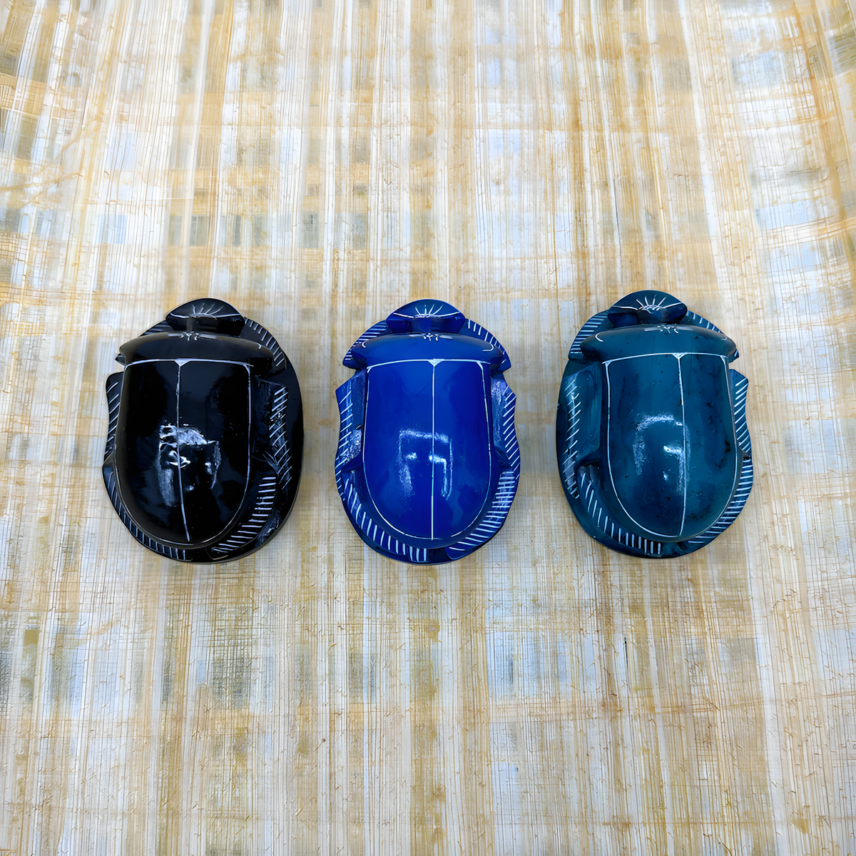 Close-up of the handmade Egyptian scarab amulet set