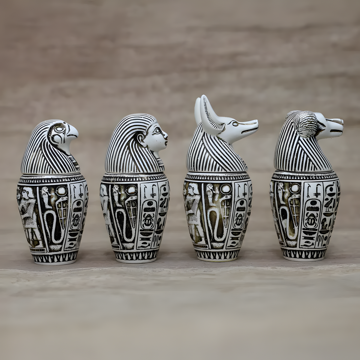 Side view of canopic jars set replica