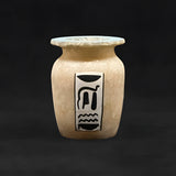 Close-up of winged scarab painting on alabaster vase