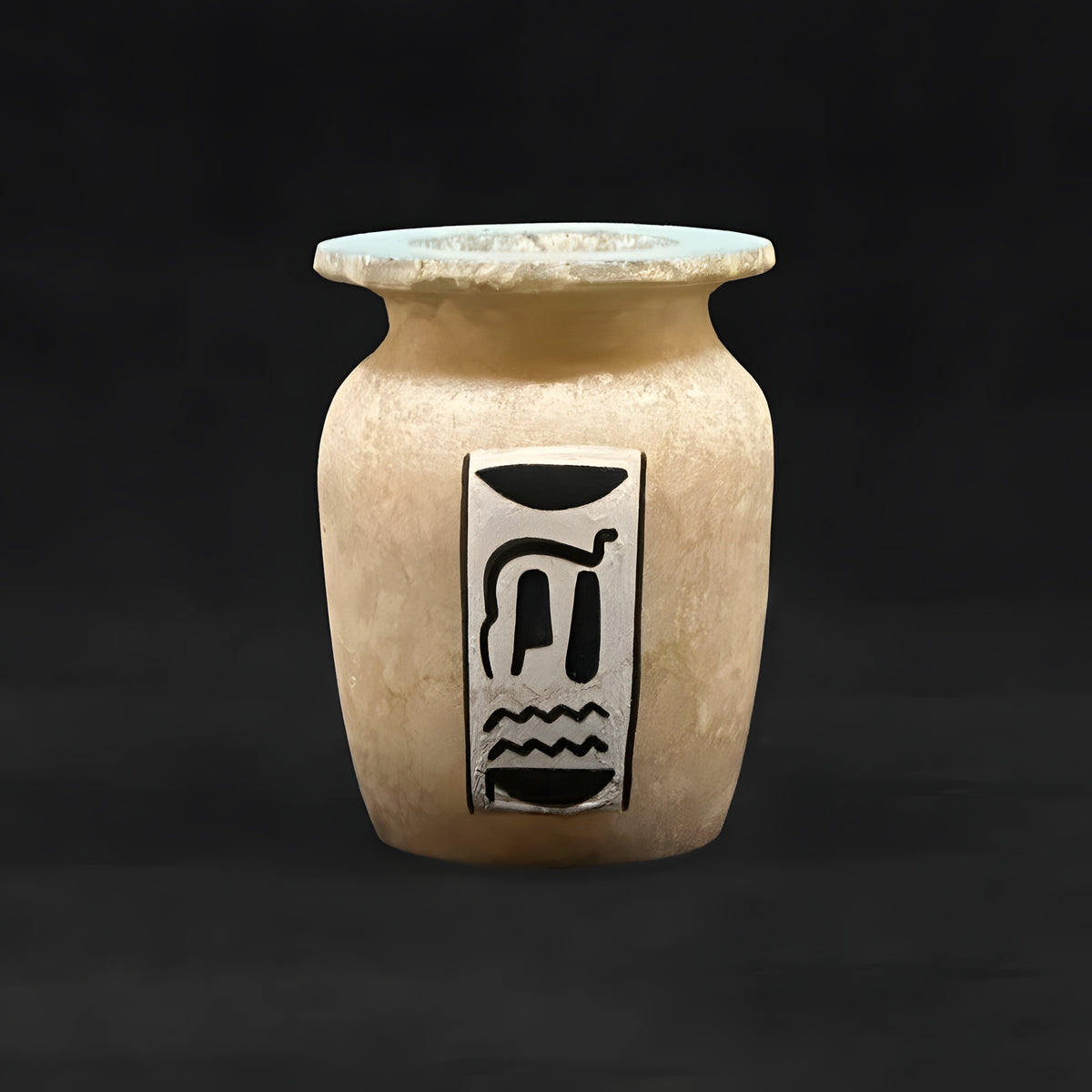Close-up of winged scarab painting on alabaster vase