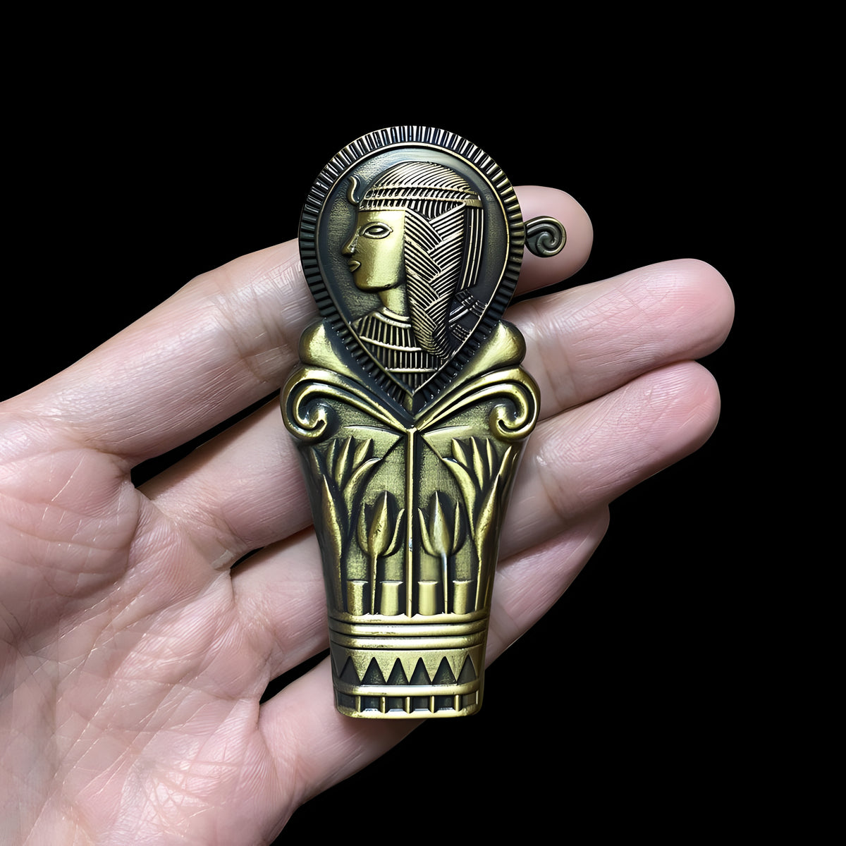 Close-up of Cleopatra design on lighter set