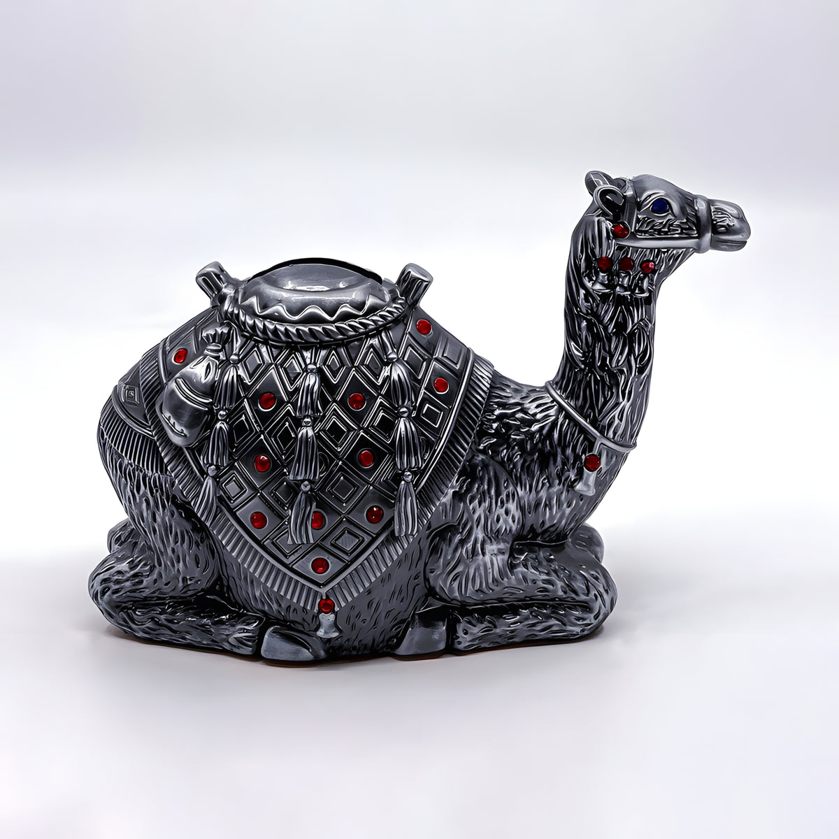 Close-up of gemstone detail on camel coin bank