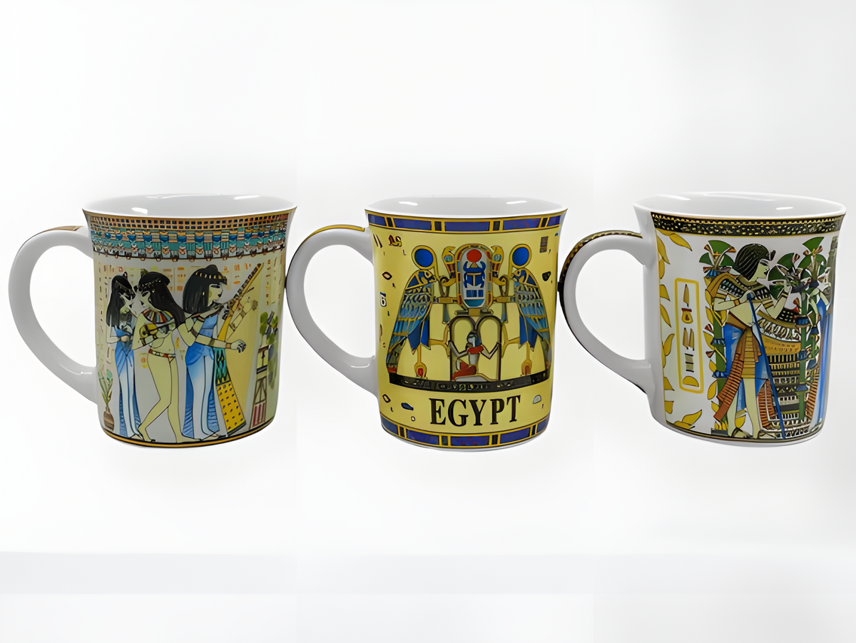 Close-up of pharaoh and god artwork on mug set