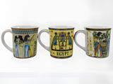 Close-up of pharaoh and god artwork on mug set