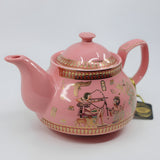 Side view of Egyptian couple teapot