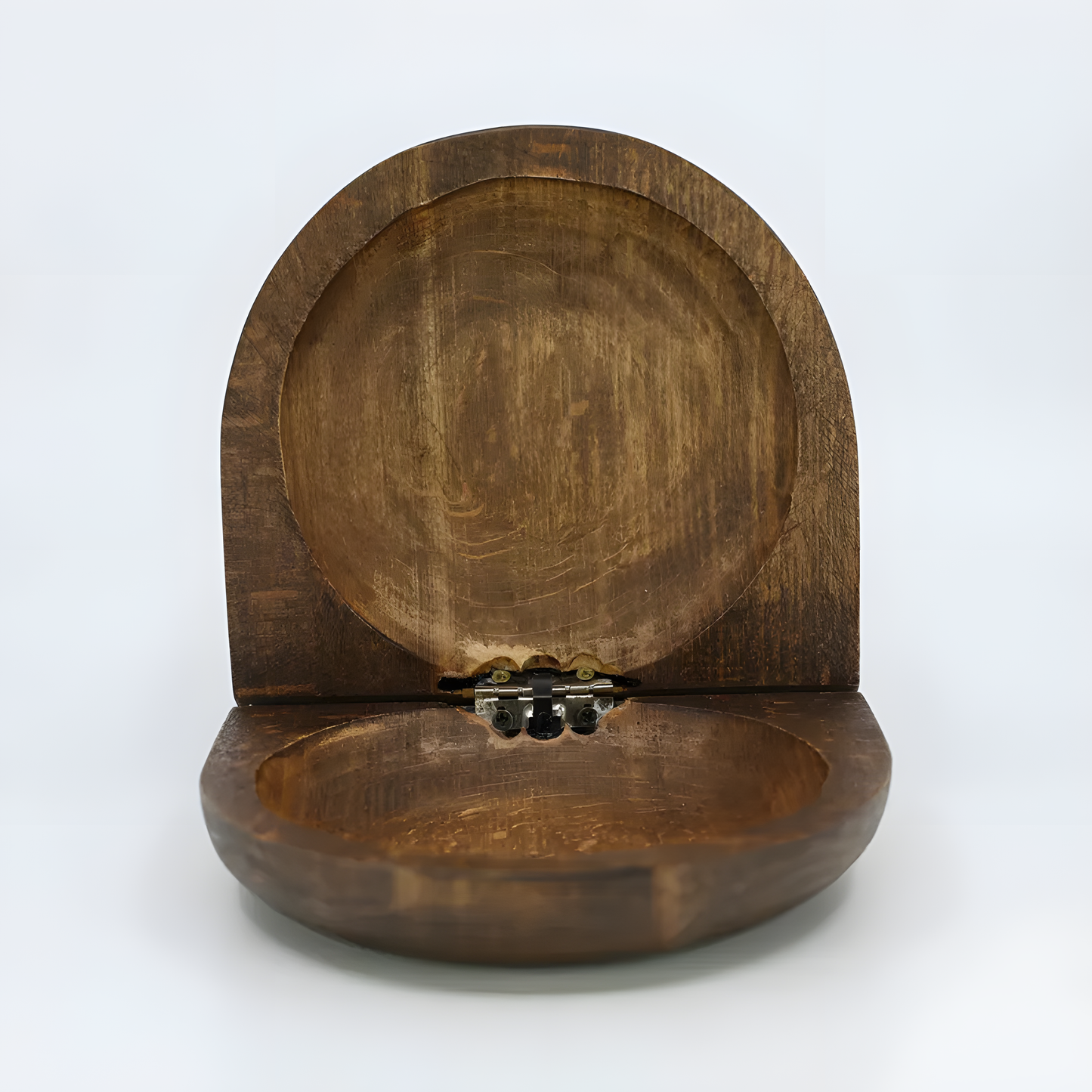 Close-up of the carved Nefertiti bust design on the wooden jewelry box lid