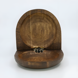 Close-up of the carved Nefertiti bust design on the wooden jewelry box lid