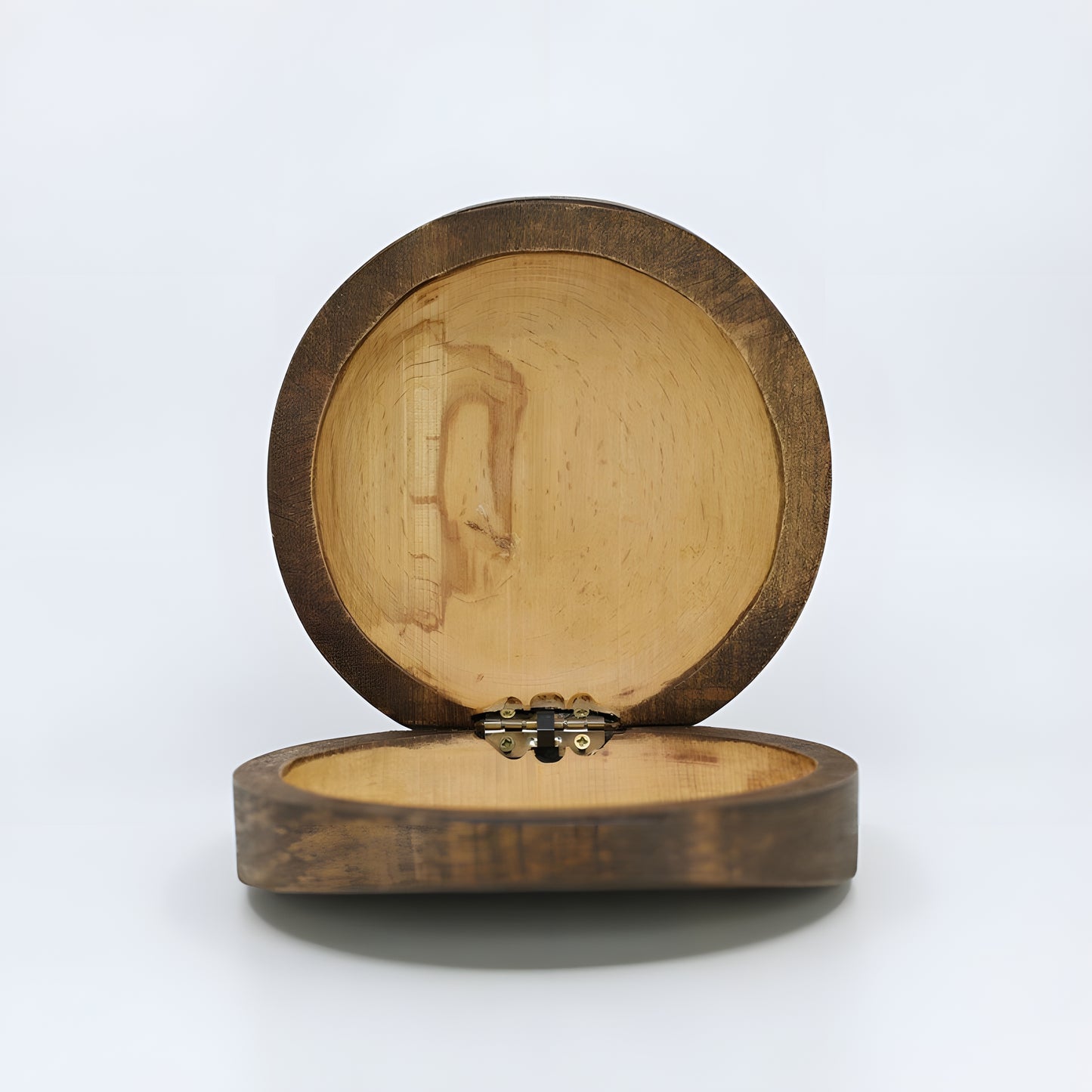 Close-up of the carved Eye of Horus design on the wooden jewelry box lid