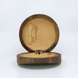 Close-up of the carved Eye of Horus design on the wooden jewelry box lid