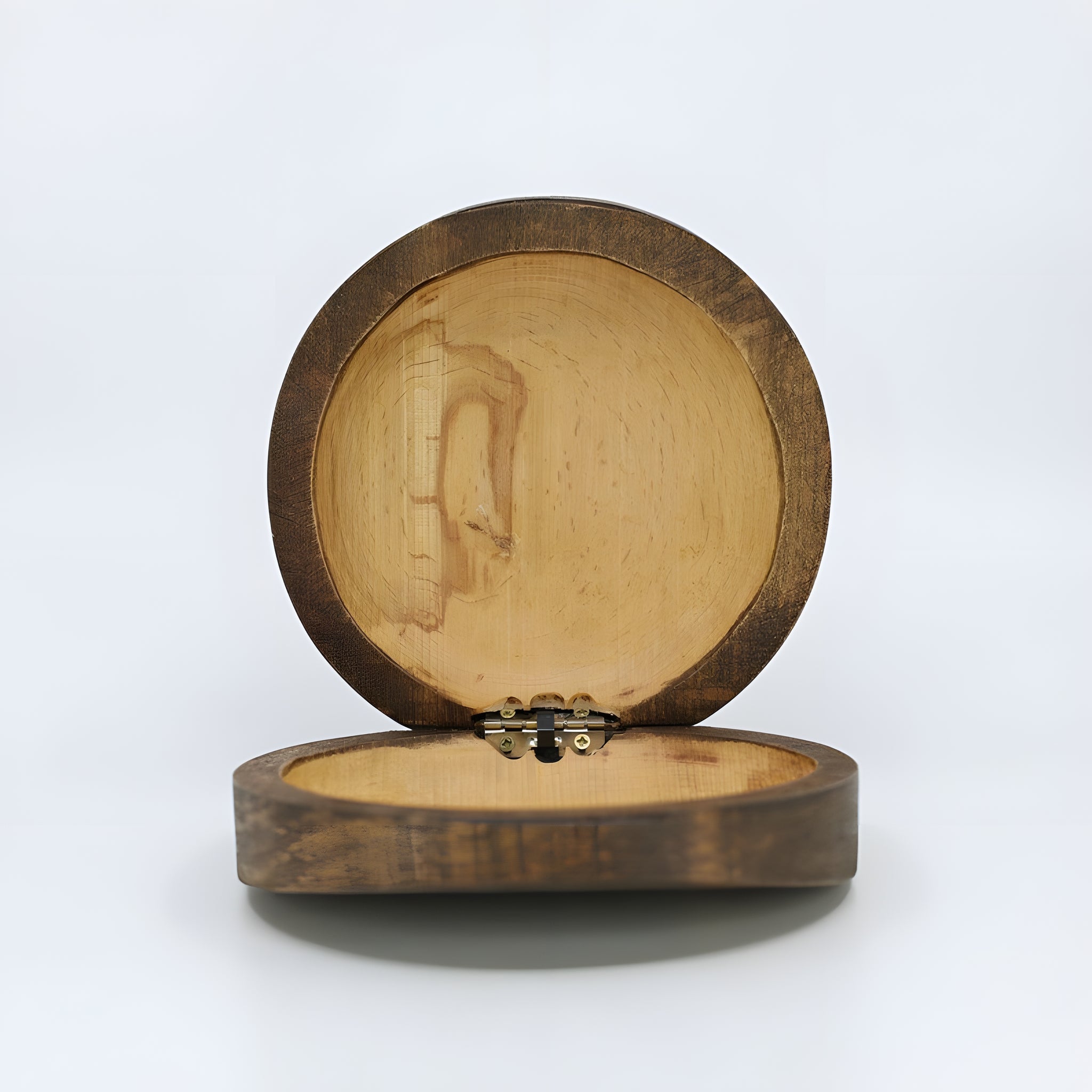Close-up of the carved Eye of Horus design on the wooden jewelry box lid