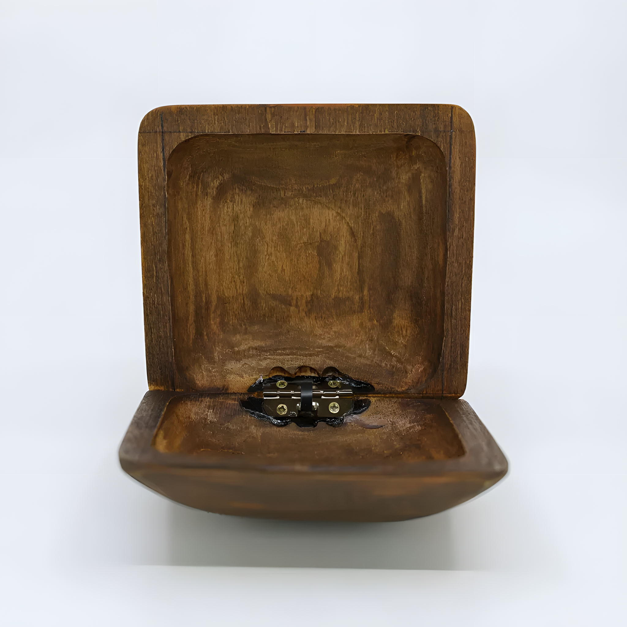 Close-up of the carved Ankh design on the wooden jewelry box lid