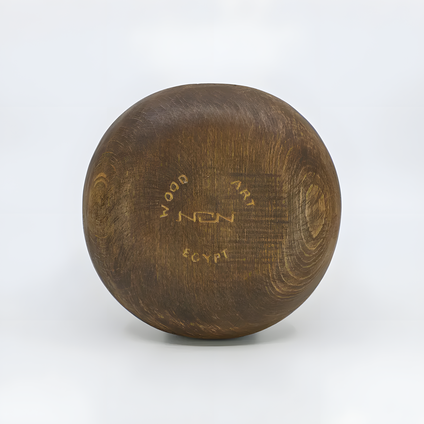 Close-up of the carved Eye of Horus design on the wooden jewelry box lid