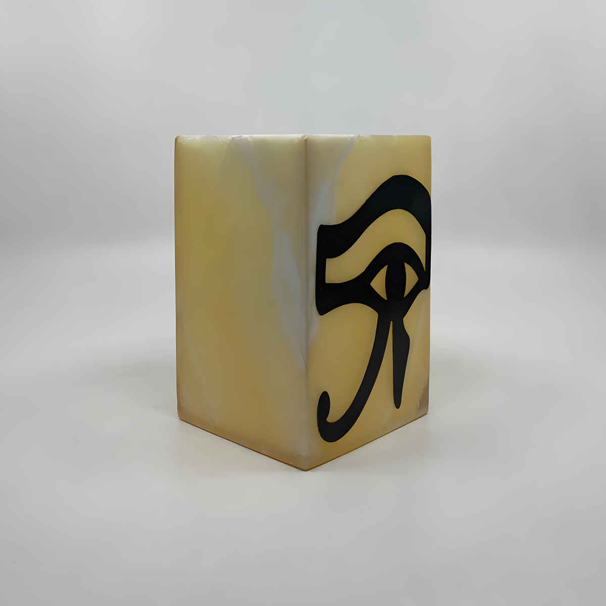 Close-up of the carved Eye of Horus symbol on the alabaster vase
