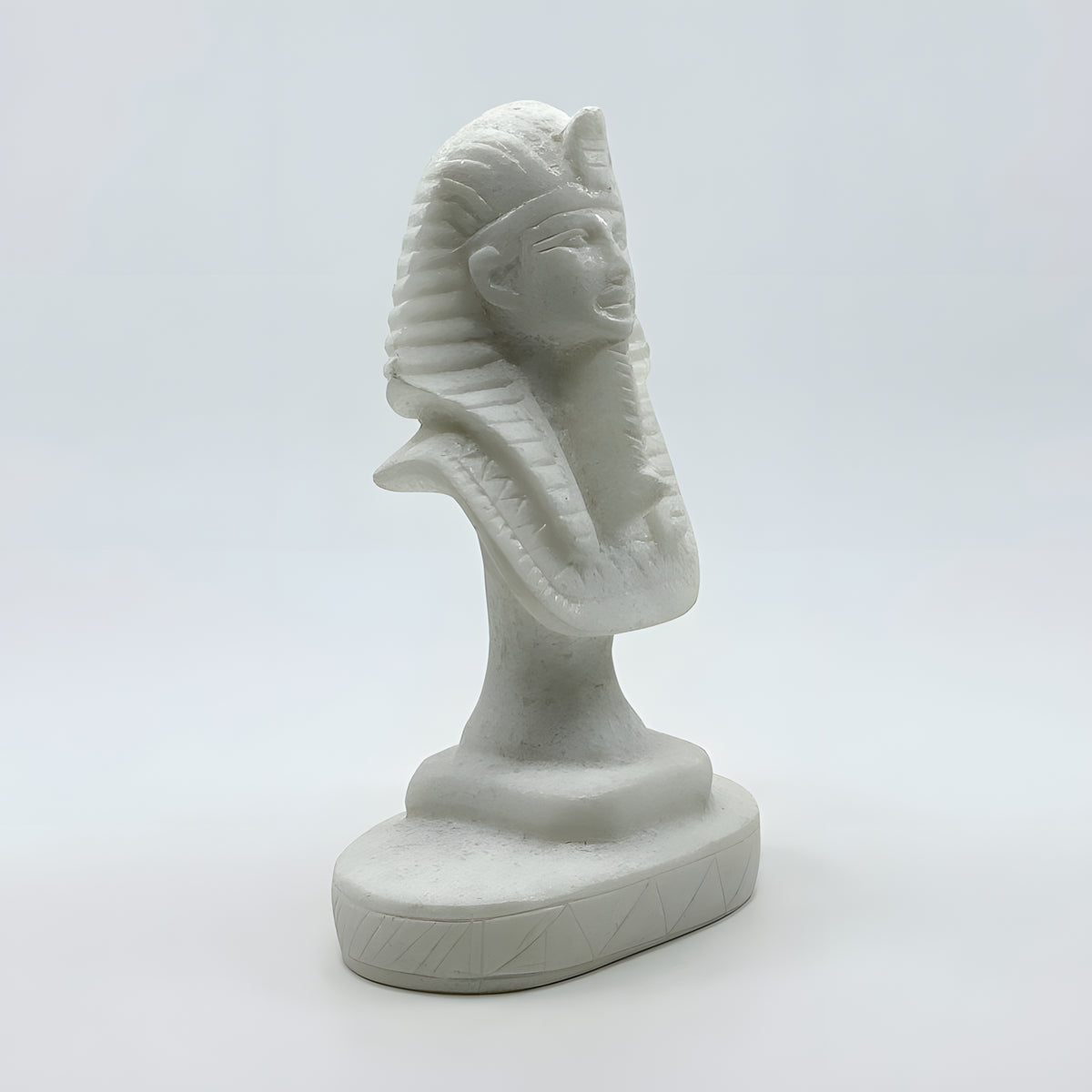 Side view of the carved alabaster Tutankhamun bust, museum reproduction