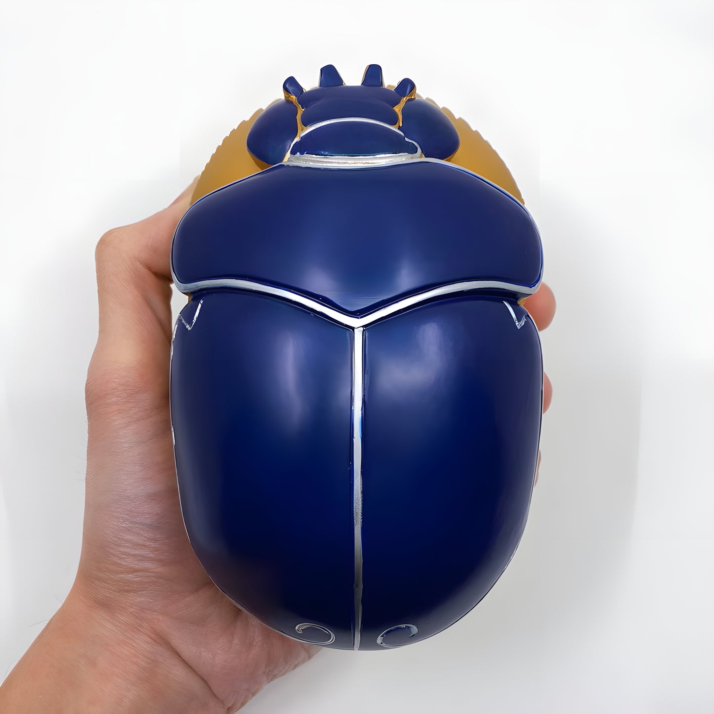 Handmade Egyptian jewelry box in polystone with a golden oval shape and blue scarab lid