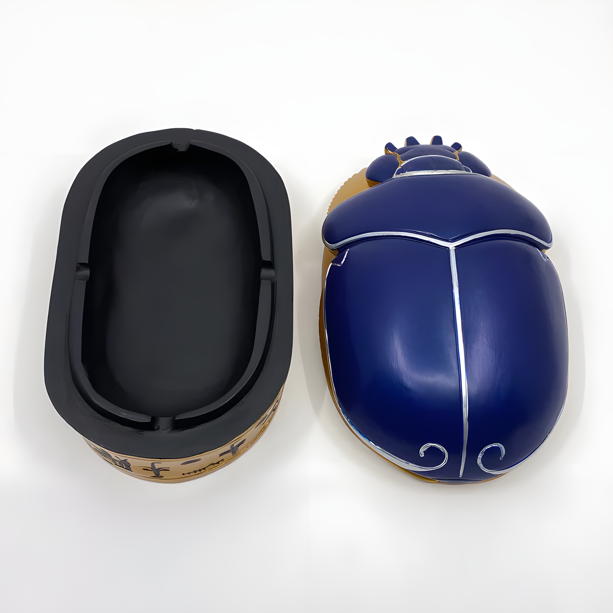 Egyptian scarab jewelry box shown open, revealing interior storage