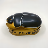 Egyptian scarab jewelry box shown from a side angle