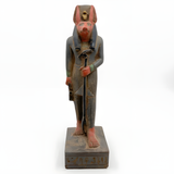 Full-length view of the hand-carved Anubis statue, museum reproduction