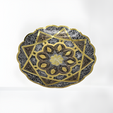 Handmade copper wall plate with hand-engraved Pharaonic-style motifs from Khan El Khalili