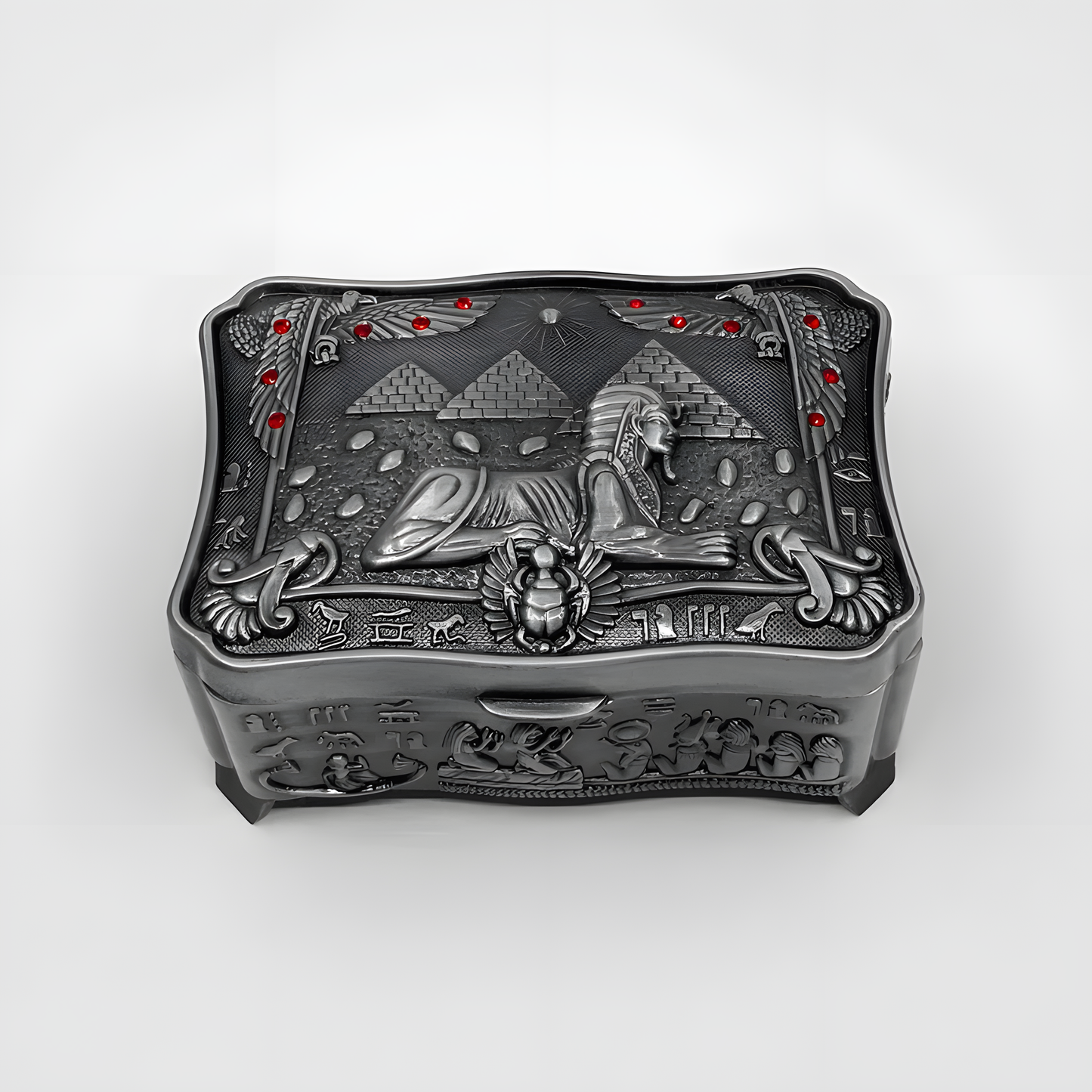 Detail view of the carved Sphinx face on the jewelry box lid