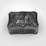 Detail view of the carved Sphinx face on the jewelry box lid