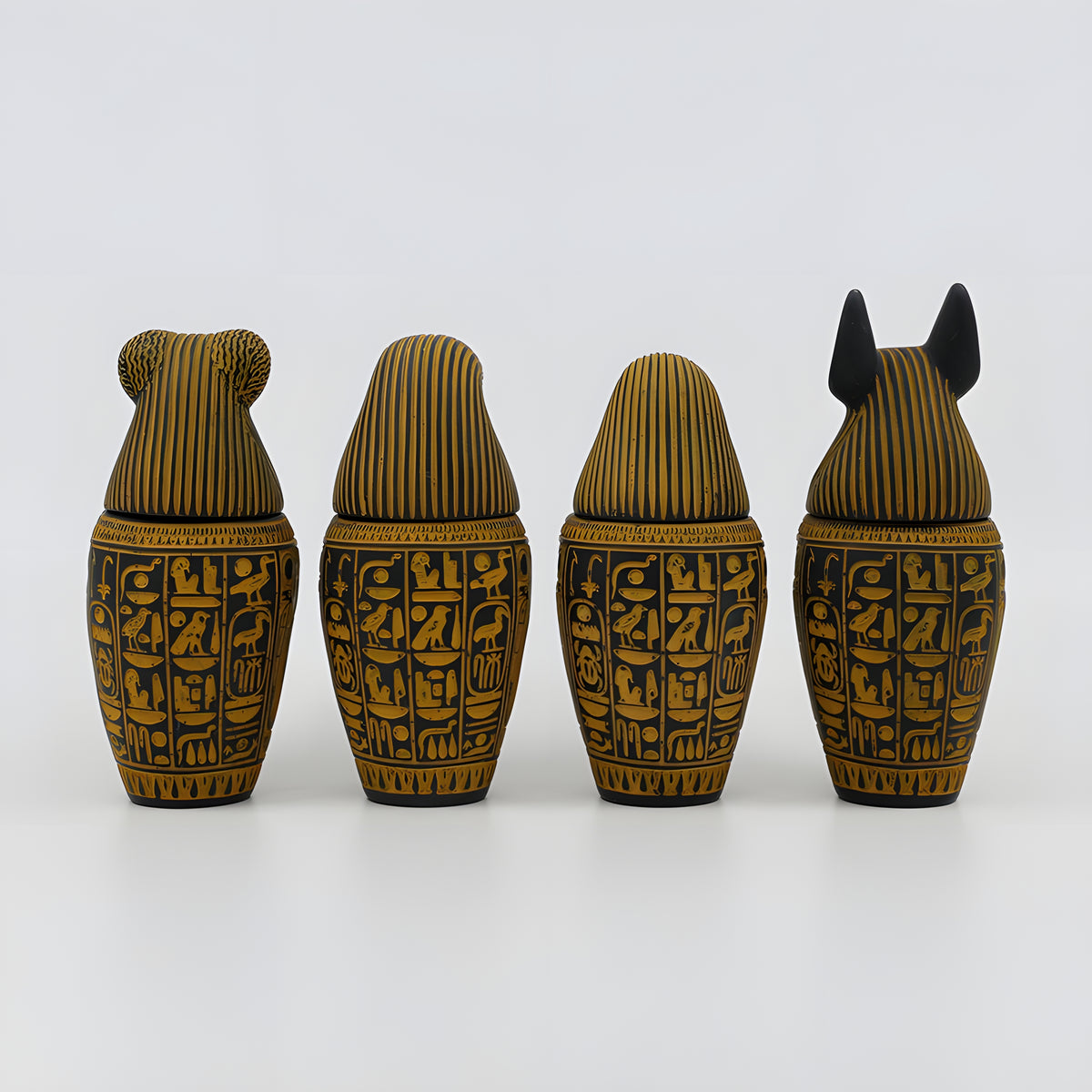 Egyptian canopic jars set, museum reproduction — full view for scale