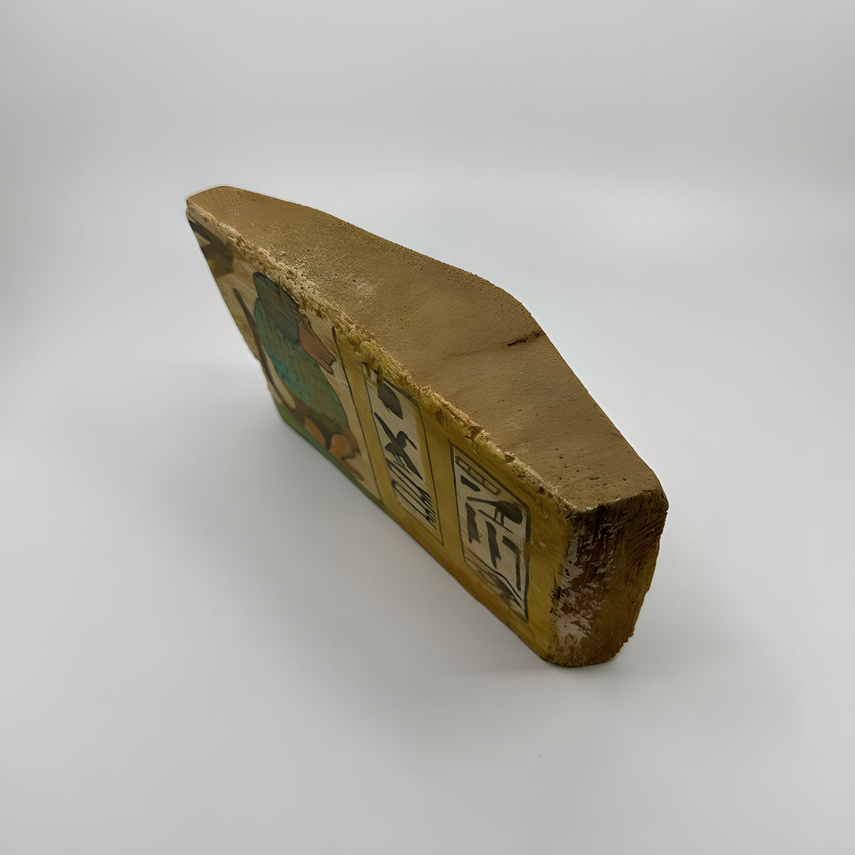 Side view of the handmade wooden Babi god palette museum reproduction