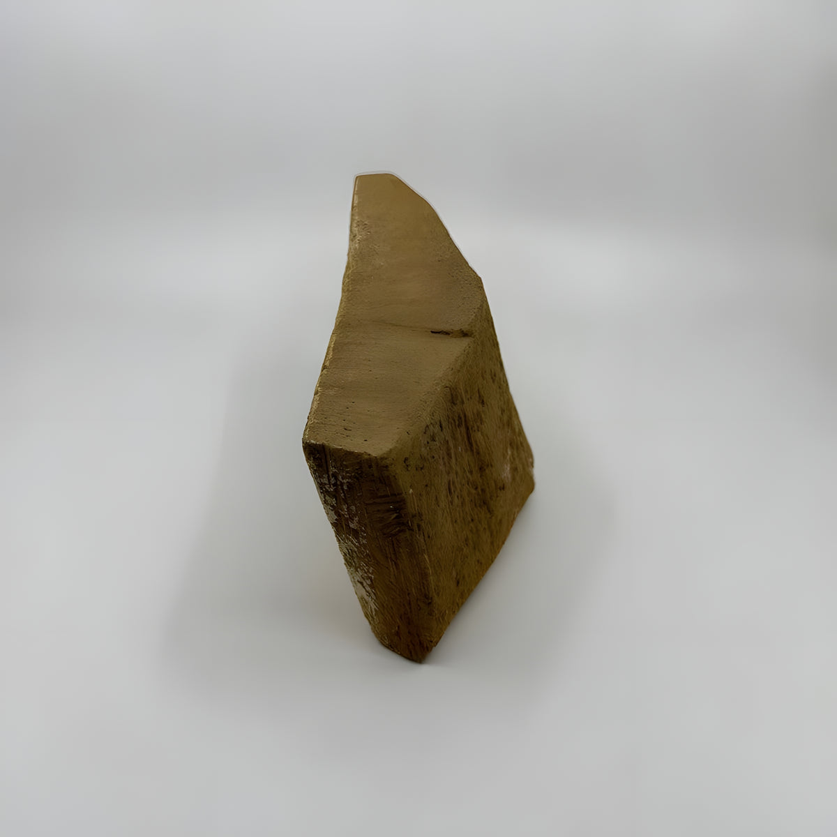 Back view of the wooden Babi god palette museum reproduction showing wood grain and craftsmanship
