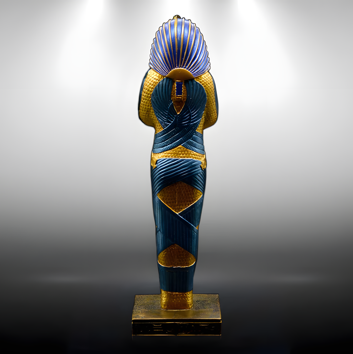 Close-up detail of the King Tutankhamun statue's painted features, museum reproduction