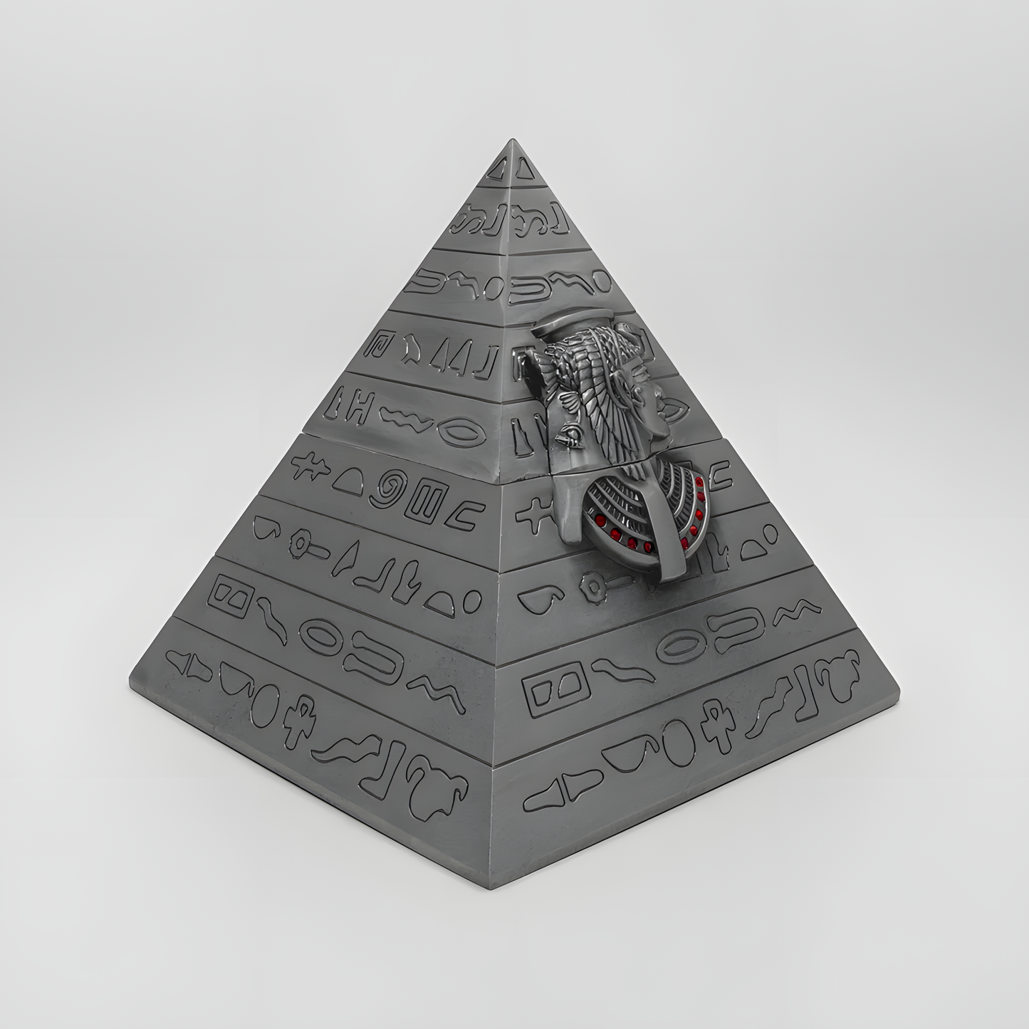 Close-up of the engraved hieroglyphic-style pattern on the pyramid jewelry box