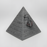 Close-up of the engraved hieroglyphic-style pattern on the pyramid jewelry box