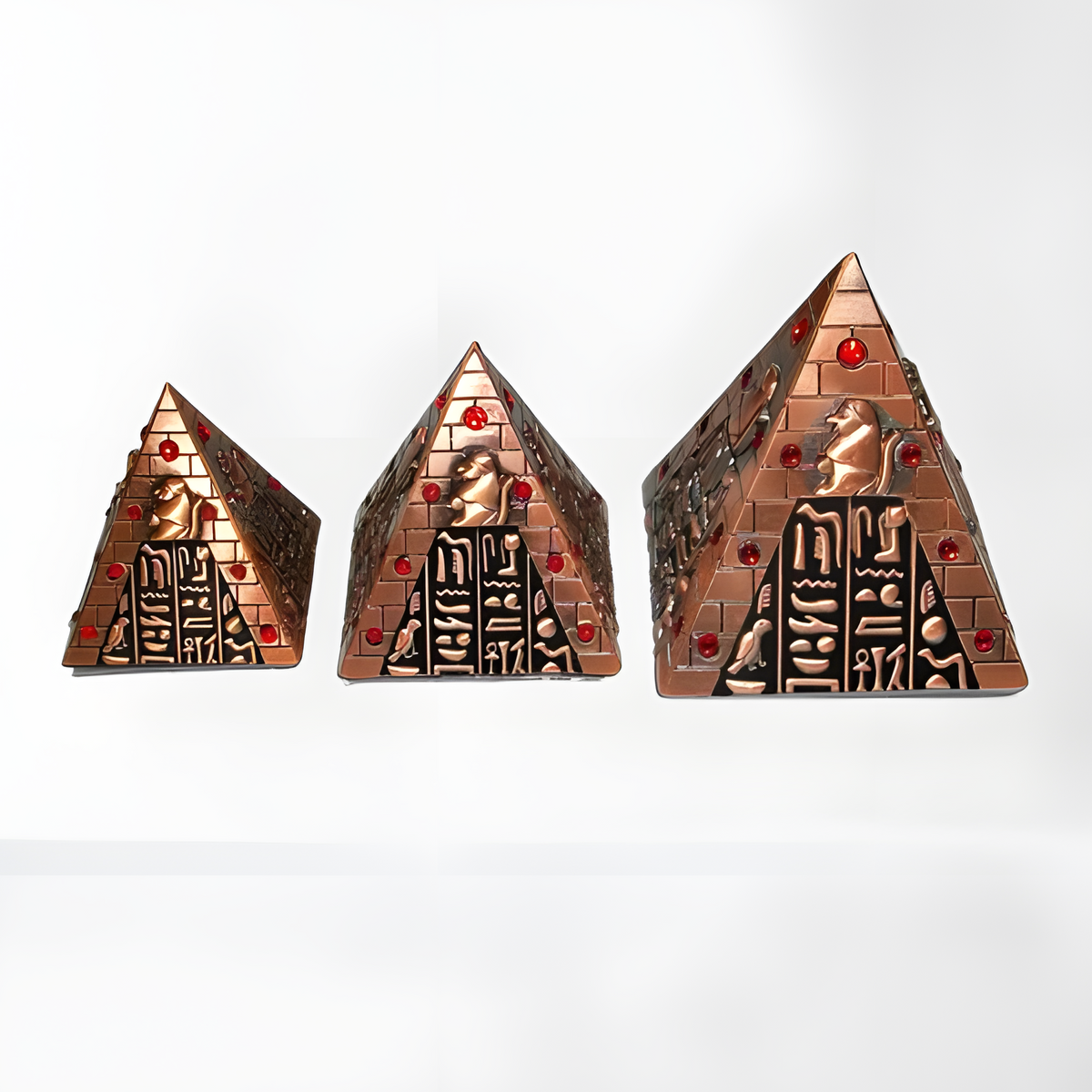 Egyptian Baboon God copper pyramid set displayed together, museum reproduction