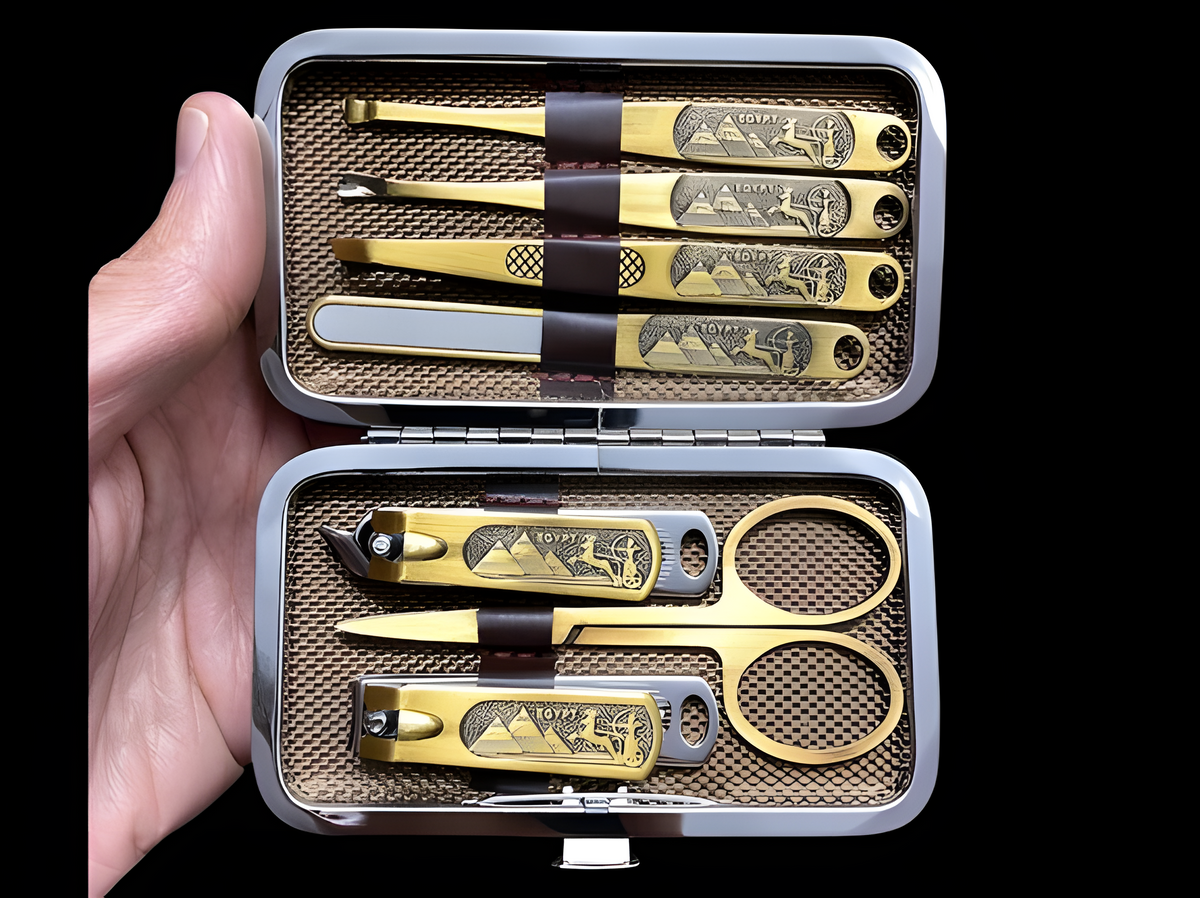 Close-up of the stainless steel manicure tools with Egyptian-style detailing