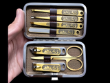 Close-up of the stainless steel manicure tools with Egyptian-style detailing