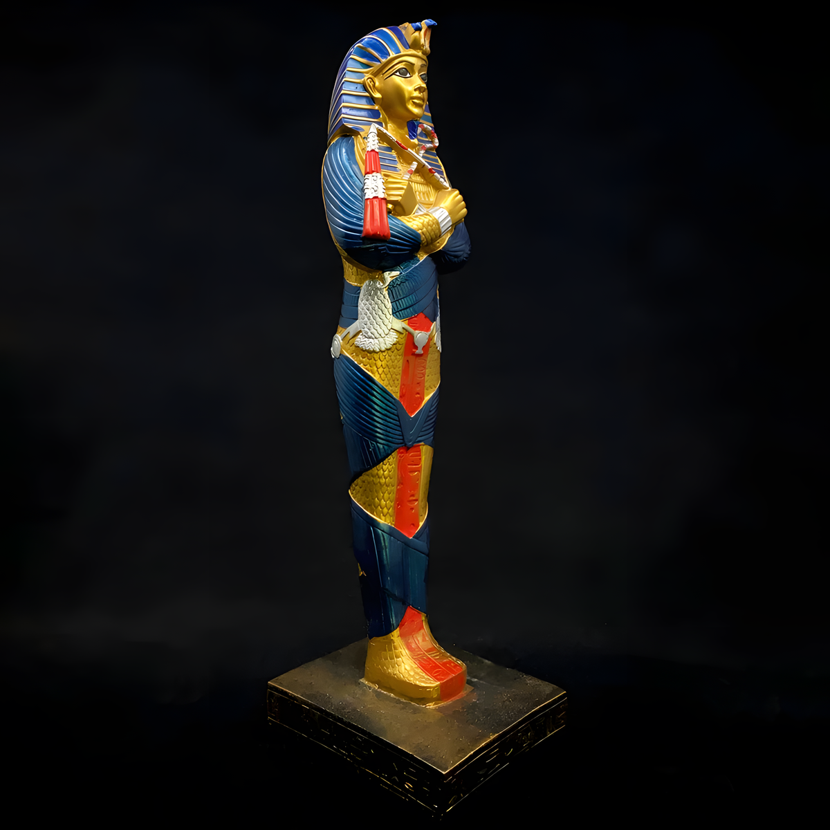 Side view of the hand-painted King Tutankhamun statue museum reproduction