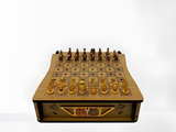 Egyptian-themed wooden chess board with copper pieces